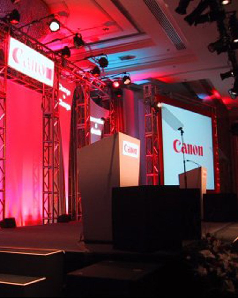 Audio Visual Equipment stage with podium and LED screens at an event in Denver, CO